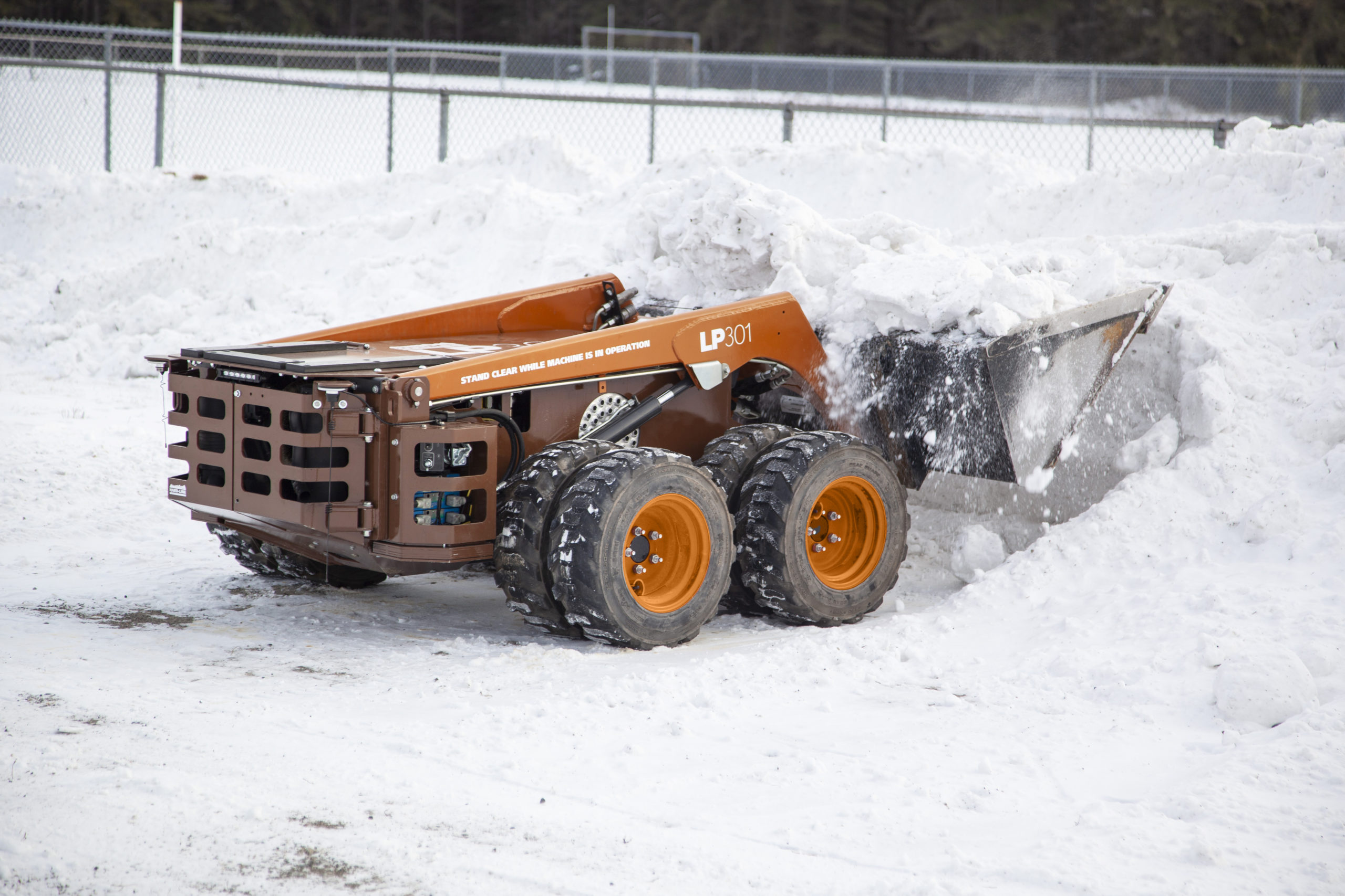 LP301 with dual wheels lifting snow