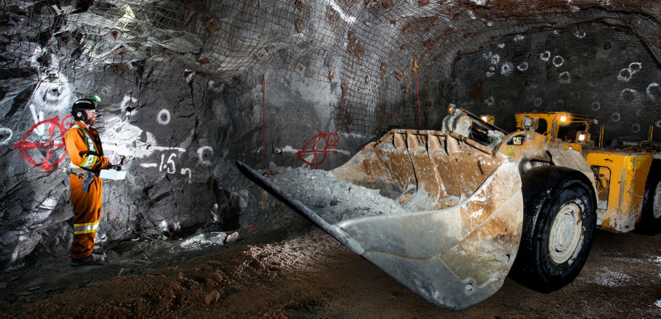 An operator is controling an LHD in an underground mineshaft using RRC